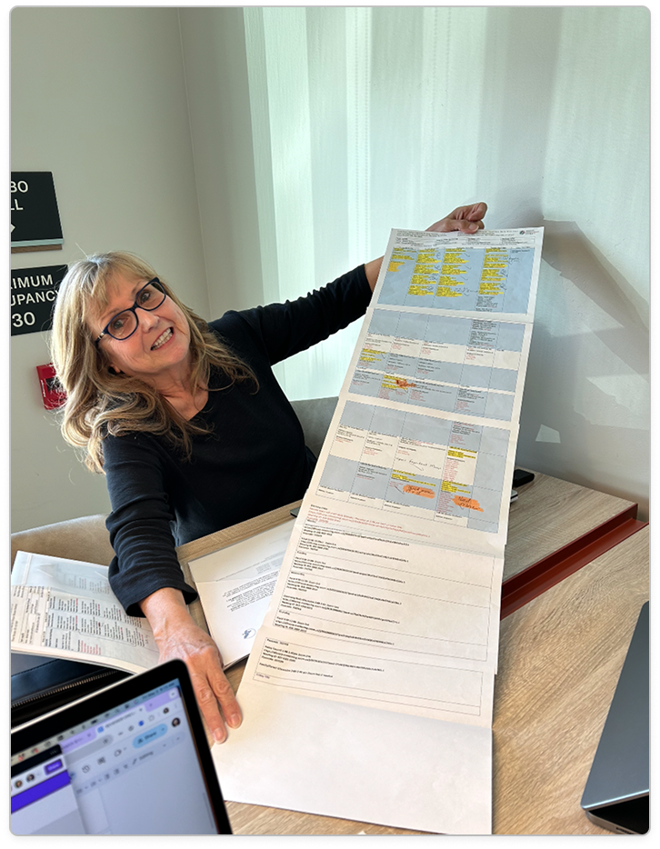 A Head Start reviewer holding up a printed review journey map