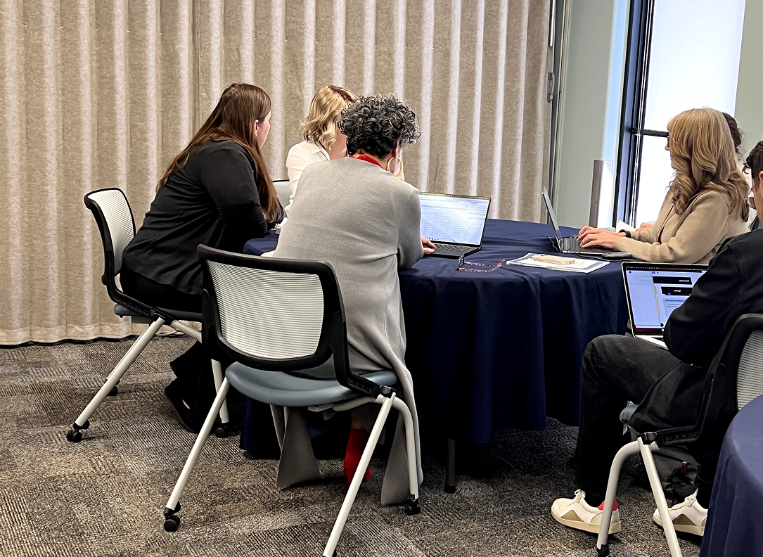 The IDEO team and Head Start reviewers working through the review process together
